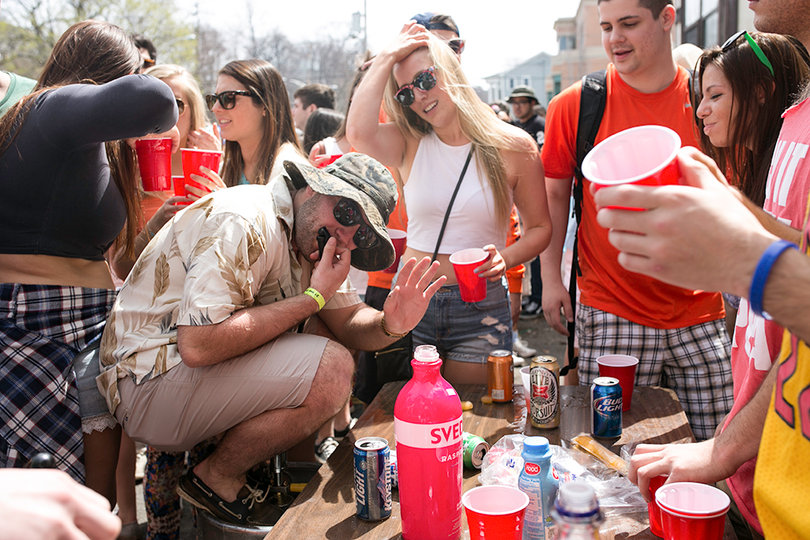 Students gather during a party at the Castle Court apartment complex. Campus Hill notified residents students will not be able to host large parties after receiving complaints from the university and the Syracuse Police Department.