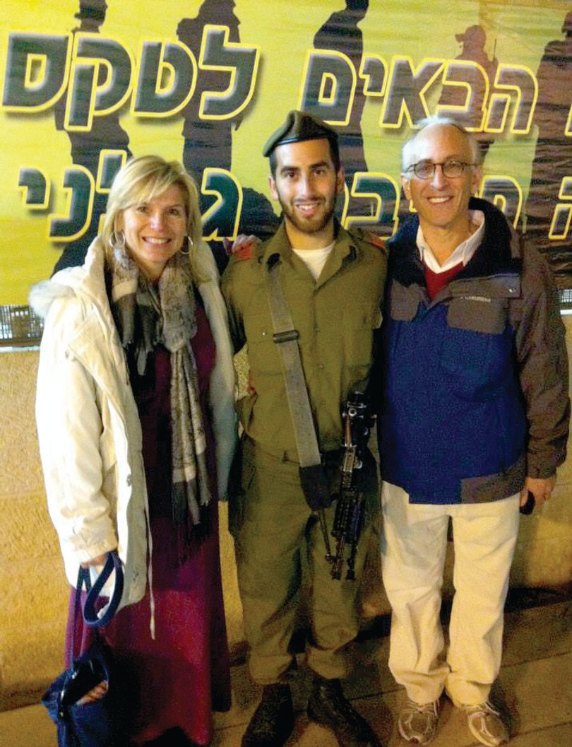 Mina and Jordan Rush, shown here with their son, helped raise over $15,000 for Harel's unit, who needed new equipment. 