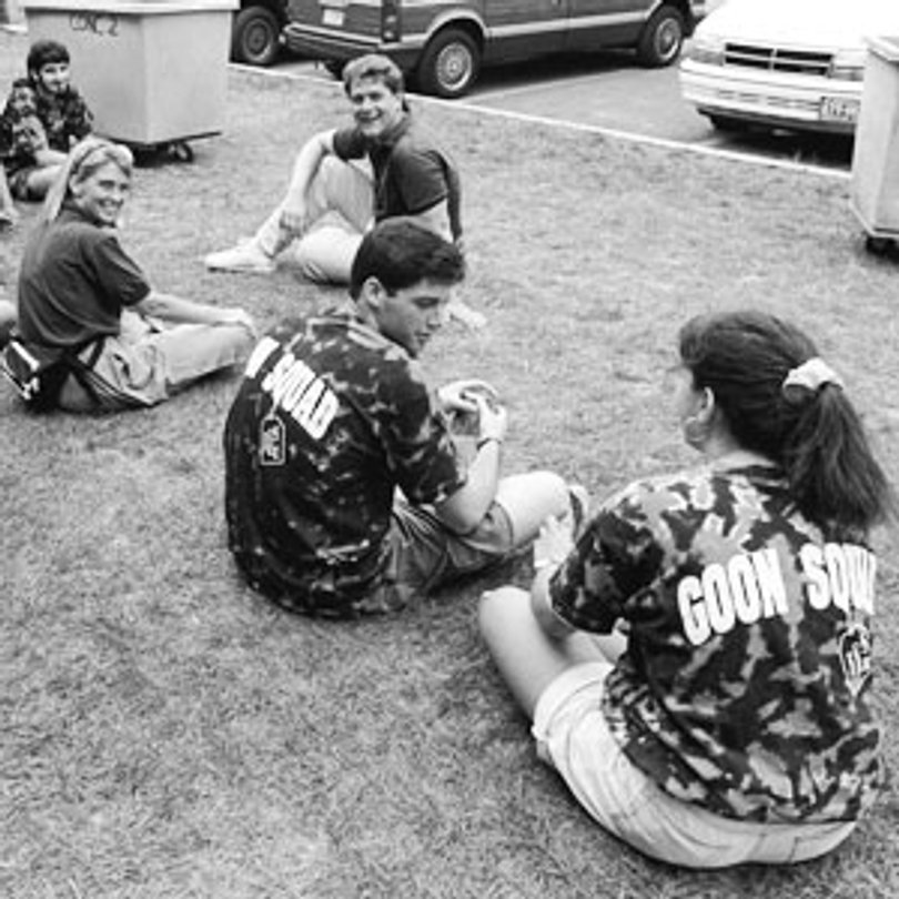 Goon Squad members take a break from their duties. The gray bins used to move the students' belongings were introduced in the late 1950s.