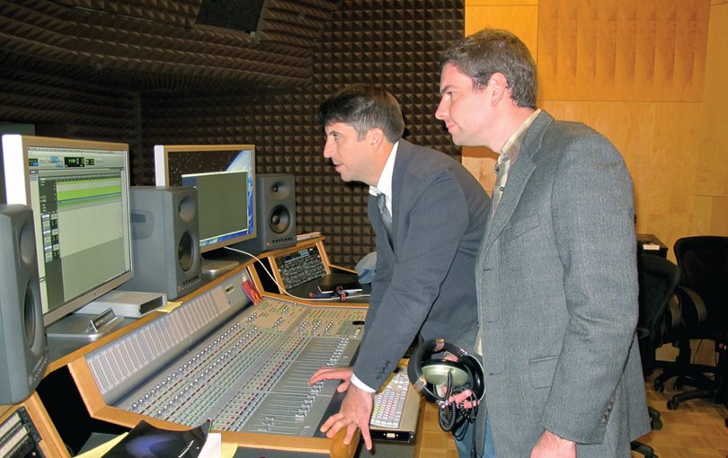 O'Connor and Barry work in the control room of Sound Beat. The show is a public radio program that gives a look at different aspects of American cultural history.