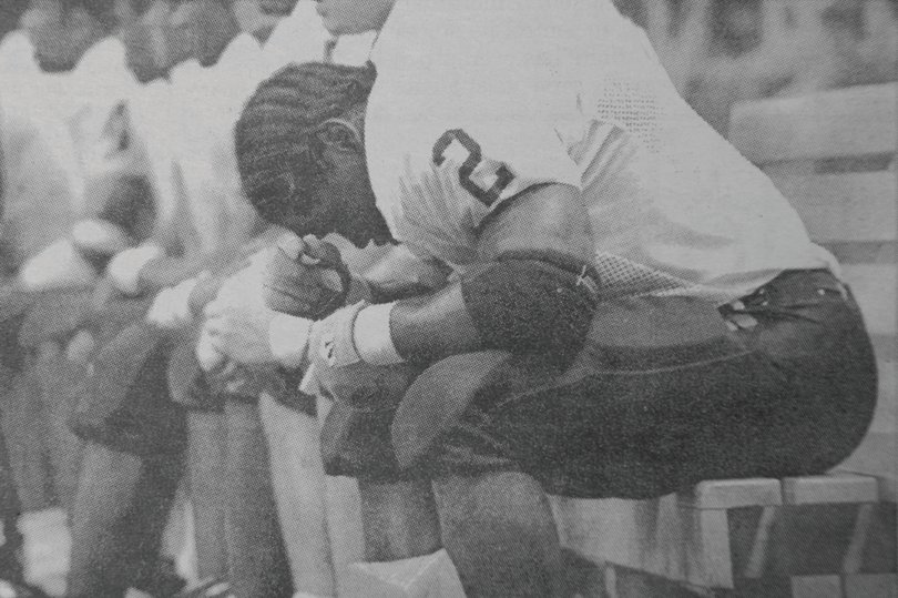 A dejected Vince Webber sits on the CMU bench during the Chippewas' 47-7 loss to SU in the Carrier Dome.