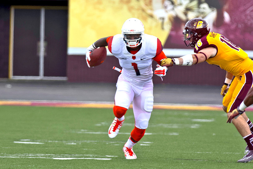 Syracuse's Ashton Broyld tries to elude Central Michigan defensive back Tony Annese and head downfield.