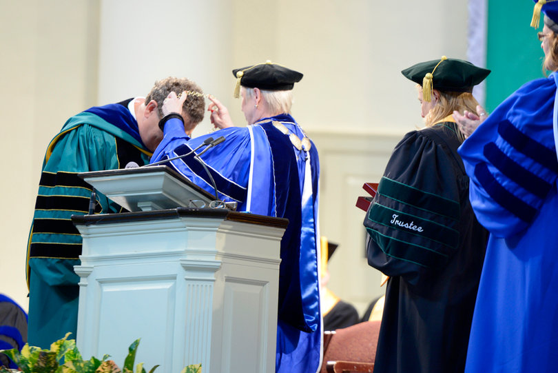 Nancy Zimpher, SUNY chancellor, places a medallion around Quentin Wheeler’s neck during his inauguration as SUNY-ESF president. 
