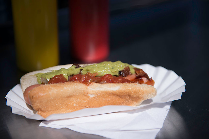 The chilean dog, topped with caramelized onions, guacamole and salsa, showcases Hodgkinson's creativity.