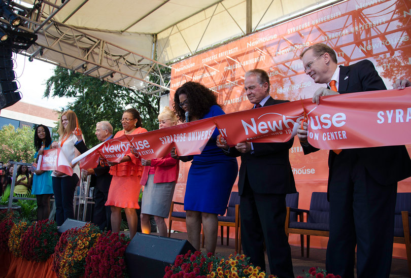 Members of the SU community and special guests gather on stage for the ribbon cutting ceremony at the Dick Clark Studios and Alan Gerry Center for Media Innovation.
