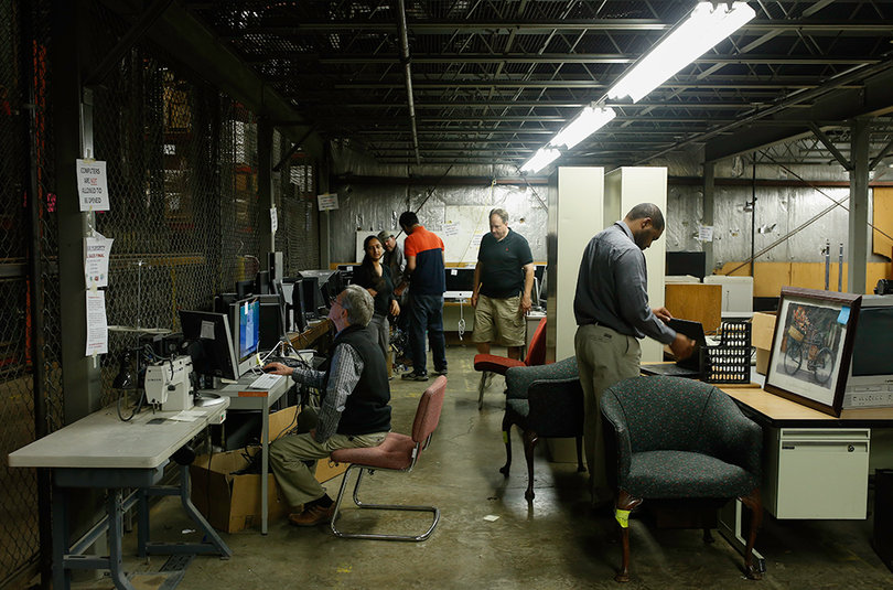 Customers browse through the varied offerings of the Excess Property Store, which is open to the public every Wednesday.