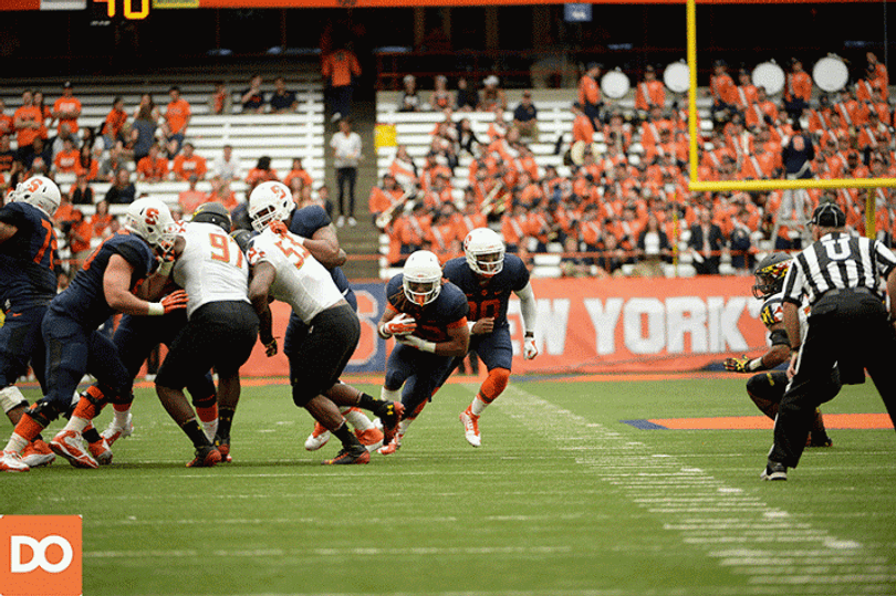 Prince-Tyson Gulley bursts up the middle after the offensive line opens a big hole. Gulley rushed for 138 yards on 14 carries in the game. 
