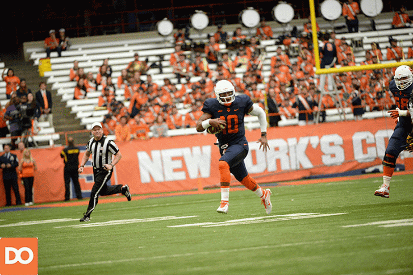 Hunt runs down the right sideline and sidesteps a chasing Maryland defender. 