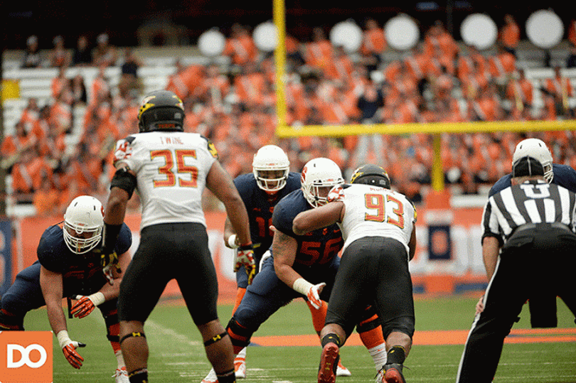 Hunt drops back to throw and targets a receiver on the left side of the field. 