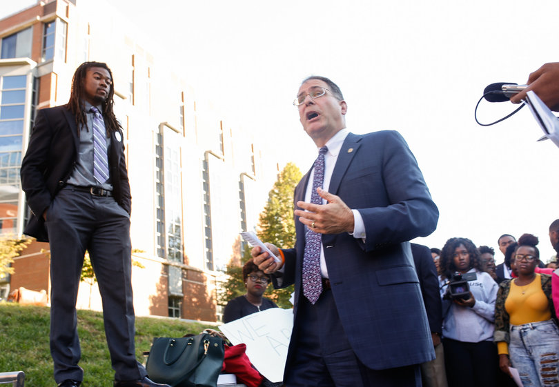 Eric Spina, vice chancellor and provost, speaks with protesters outside the Life Sciences building during the "Rally for a Difference" demonstration in front of the Life Sciences building on Friday.