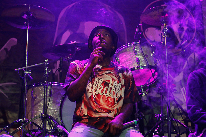 DJ Dizzy Wright takes a break to smoke a blunt in the middle of his set at the Westcott Theater.
