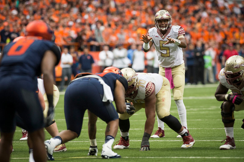Jameis Winston scans Syracuse's defense during his team's win. The Orange's offense stayed in the game thanks in large part to freshmen AJ Long and Steve Ishmael, but couldn't quite keep up with Winston and the Seminoles attack. 