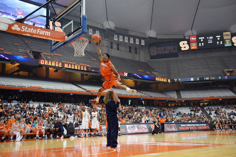 Freshman forward Chris McCullough clears a girl holding a Jim Boeheim "big head" during the dunk contest. He finished second to sophomore B.J. Johnson. 