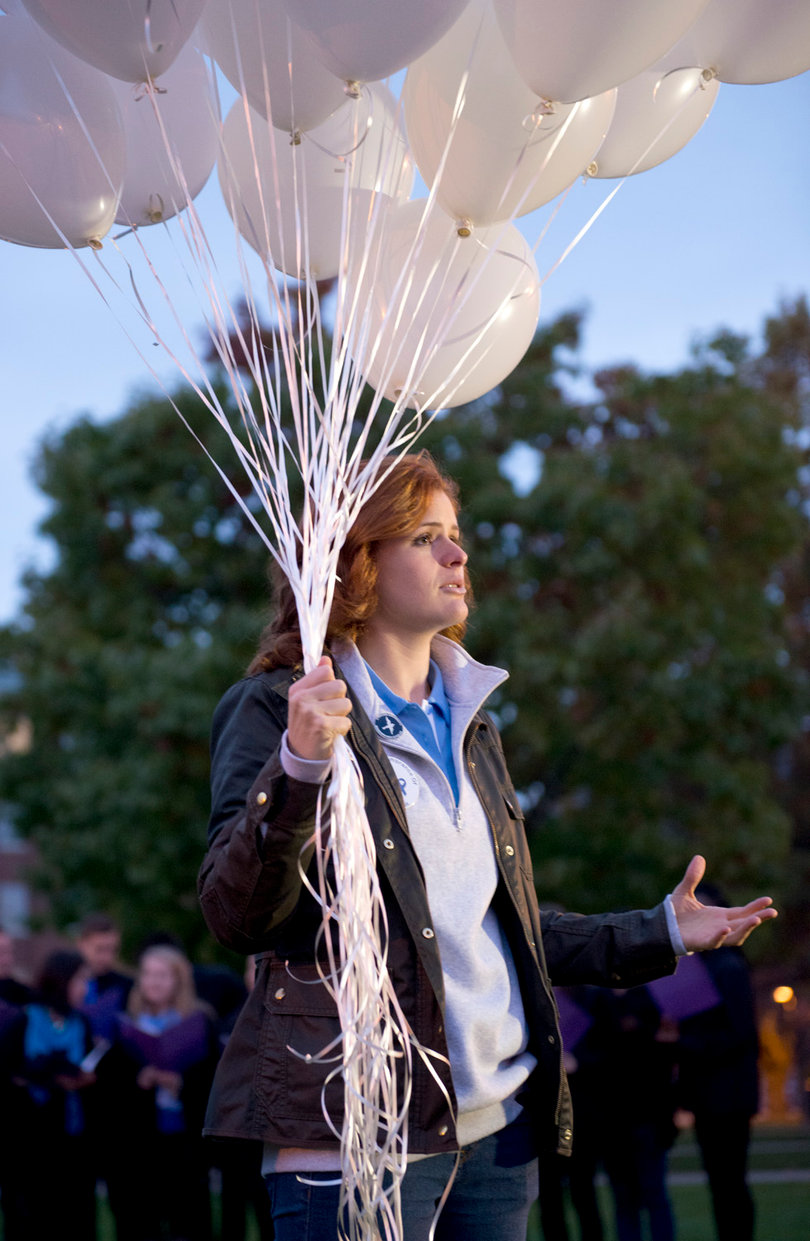 Hailey Temple, a senior public relations and  information management and technology dual major and 2014 Remembrance Scholar, began the event by releasing a bundle of white balloons and explaining the meaning behind the event. 