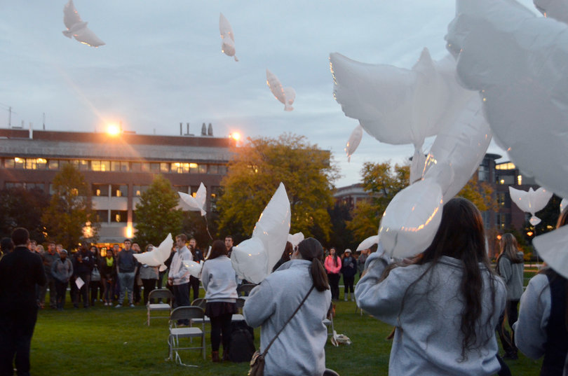 2014 Remembrance Scholars release bio-safe dove-shaped balloons on the Quad on Monday night. 
