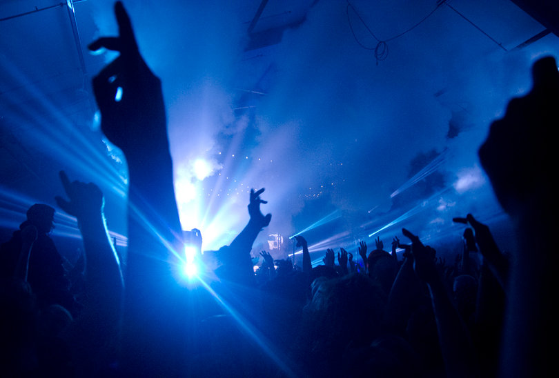 Concertgoers raise their hands in the air for Skrillex during his set. The DJ mixed several songs from his new album, “Recess.”