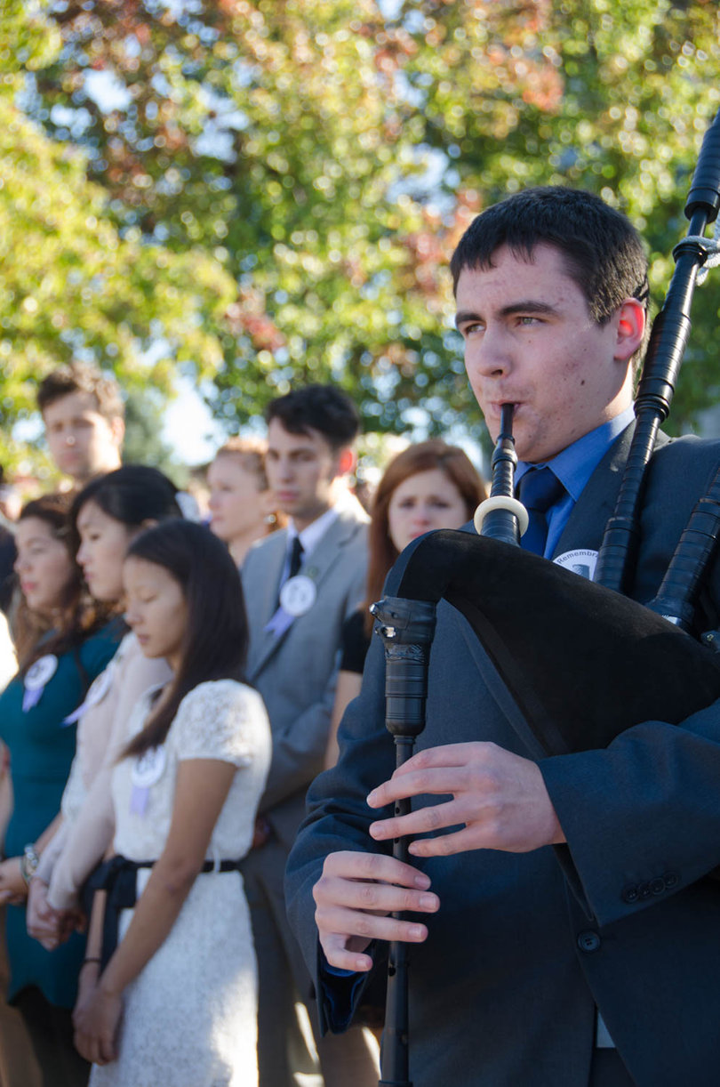 Zac Lockerbie, a visitor from Scotland, plays "Amazing Grace" on the bagpipes near the conclusion of the Rose Laying Ceremony.