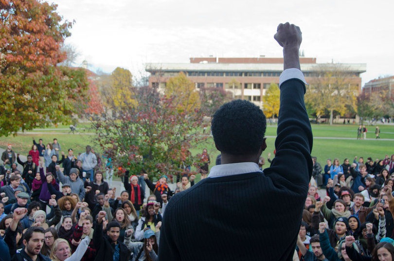 Colton Jones, a senior psychology major and one of the Diversity and Transparency Rally organizers, leads the crowd in a chant during the DAT Rally on Monday afternoon. 