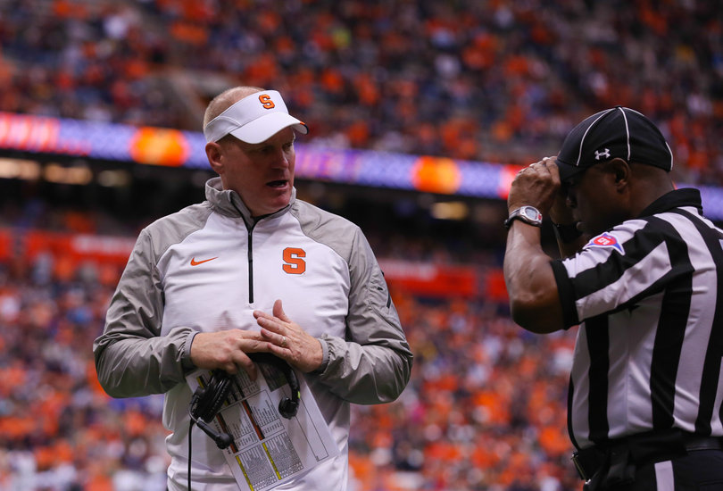 SU head coach Scott Shafer talks to a referee on the sideline. 