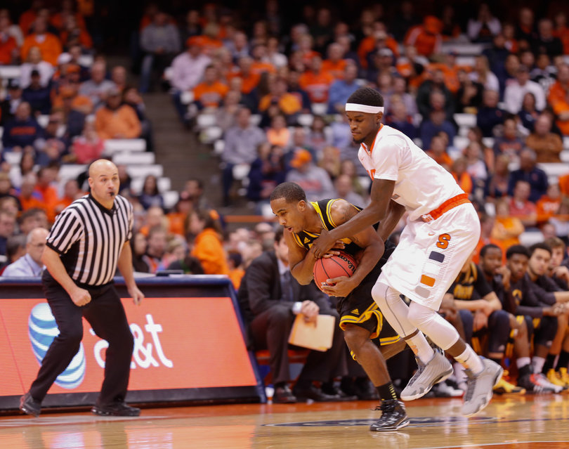 Johnson fights for the ball against an Owls player. The sophomore forward recorded a career-high in points and rebounds in the season opener.