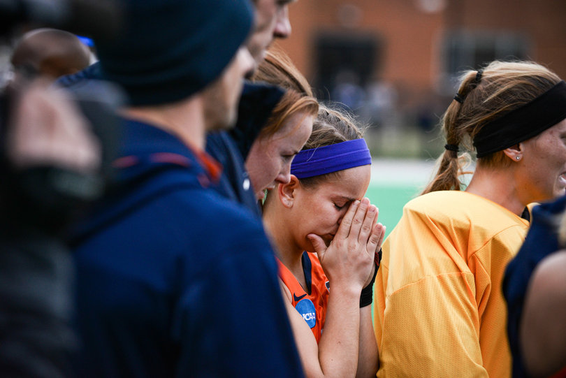 A Syracuse player covers her face after losing to UConn in Sunday's national championship. SU had a penalty corner with 21 seconds left but failed to convert. It would've tied the game at 1-1.