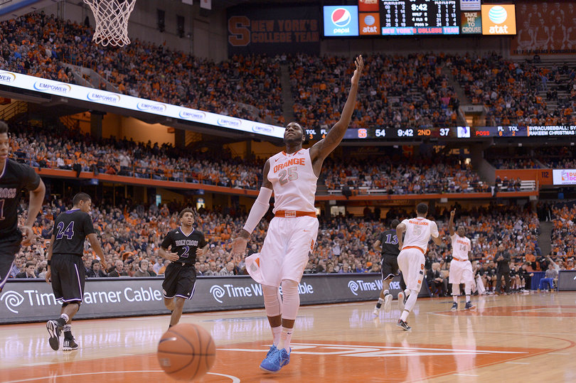 Christmas raises his left hand in celebration after his dunk put SU up by 17 in the second half.