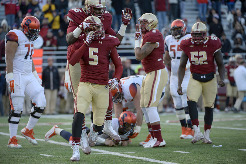 BC defensive back Ty-Meer Brown (5) and defensive end Seyi Adebayo celebrate a sack of SU quarterback AJ Long.