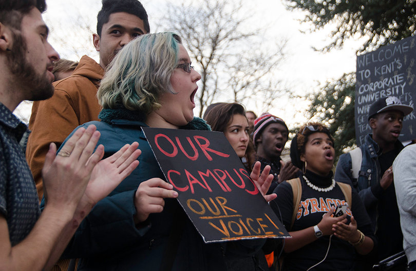 Madeleine Slade, a junior illustration major, holds a sign during the Diversity and Transparency Rally held by THE General Body on Nov. 3. After the rally, protesters marched to Crouse-Hinds Hall and began the sit-in in the lobby of the building, which lasted 18 days.