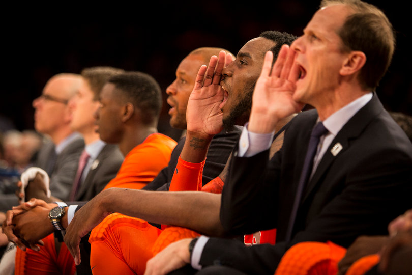 Orange assistant coach Mike Hopkins (right) and Christmas (left) yell from the bench. 