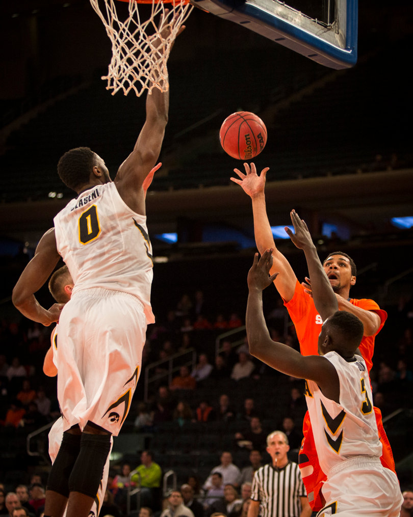 Syracuse junior forward Michael Gbinije tries a floater from the baseline. 