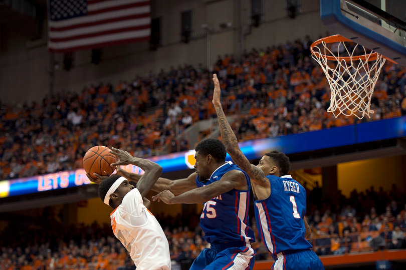 Sophomore forward B.J. Johnson goes up for a contested shot in the paint against two LT defenders.