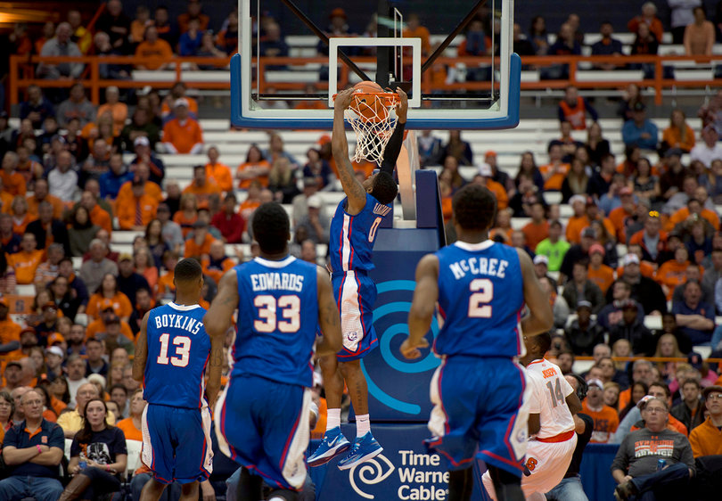 Louisiana Tech guard Alex Hamilton finishes off a dunk as Kaleb Joseph watches.
