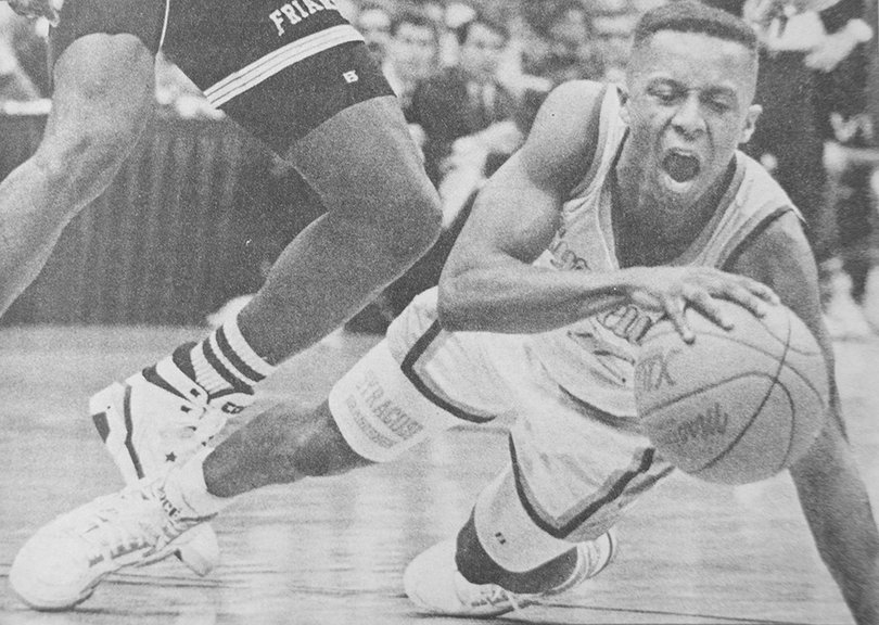 Syracuse freshman point guard Michael Edwards falls while bringing up the ball against Providence.