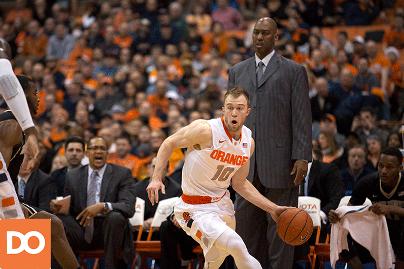 Orange guard Trevor Cooney runs along the baseline and flicks up a layup attempt.
