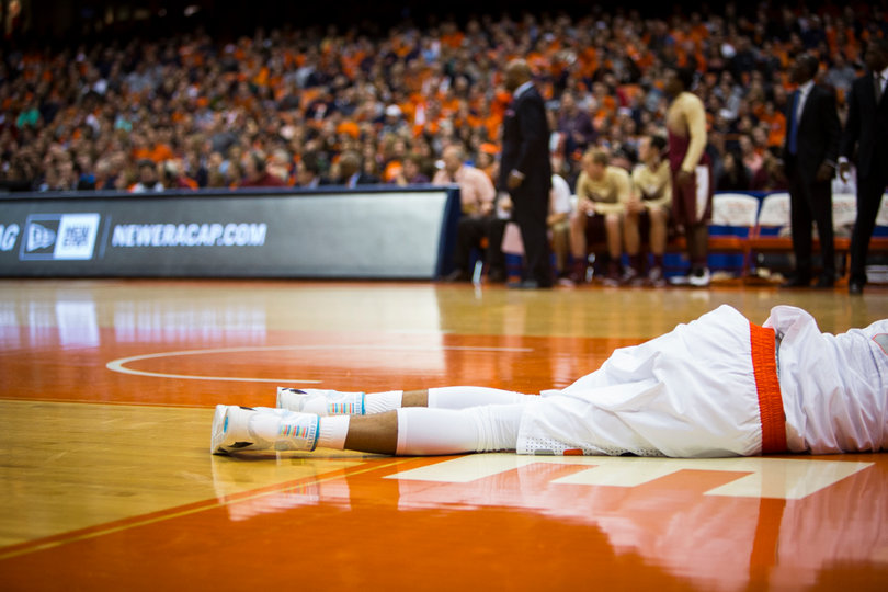 McCullough lies on the baseline after going down with an apparent knee injury. He returned to the locker room and was ruled out for the game.