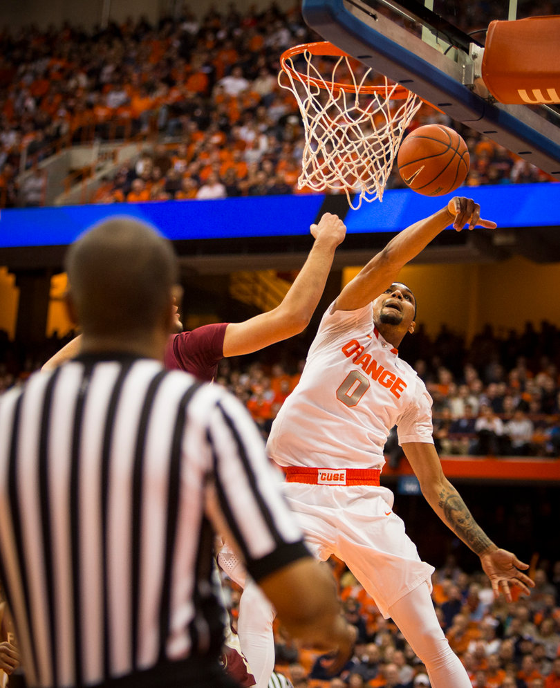 Michael Gbinije goes after a loose ball at the rim. The junior had seven first-half points on 3-of-7 shooting.
