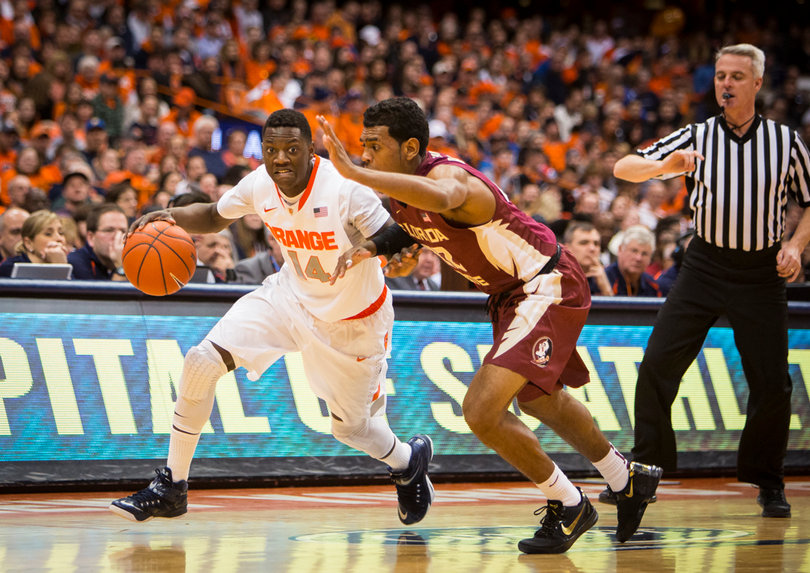 Point guard Kaleb Joseph drives the ball down the court past Florida State's defense, looking for an opening.