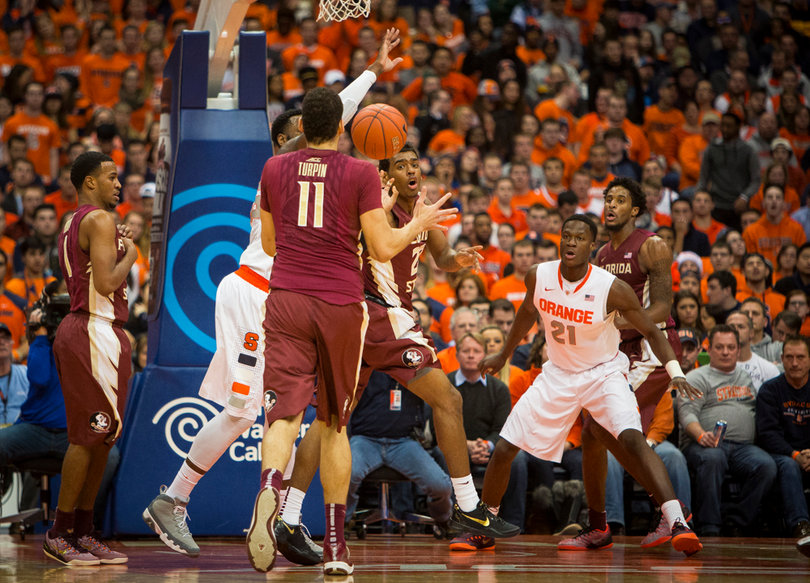 SU forward Tyler Roberson defends in the post while FSU's Kiel Turpin tries to make a play. 