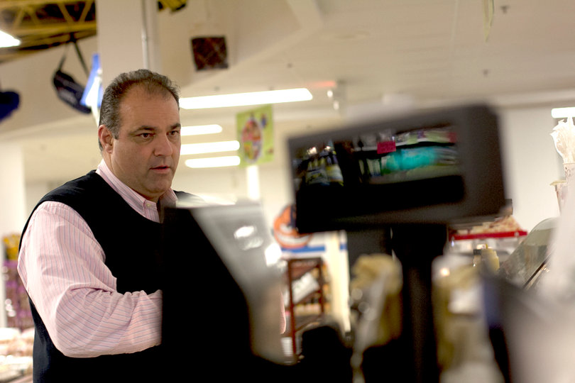 Paul Nojaim checks out store items for online shoppers and prepares the items for delivery.               