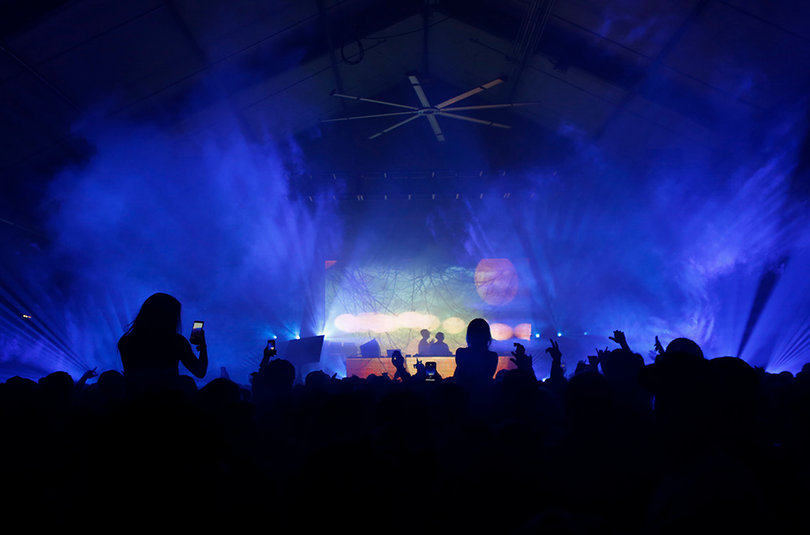 Above and Beyond uses images of landscapes and flowers as their visual background during their EDM performance.