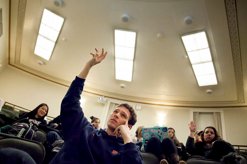 Parliamentarian Stephen Thomas raises his hand during discussion of the proposed name change during Monday night's meeting. The assembly originally voted in favor of the proposed name change during last week's meeting.