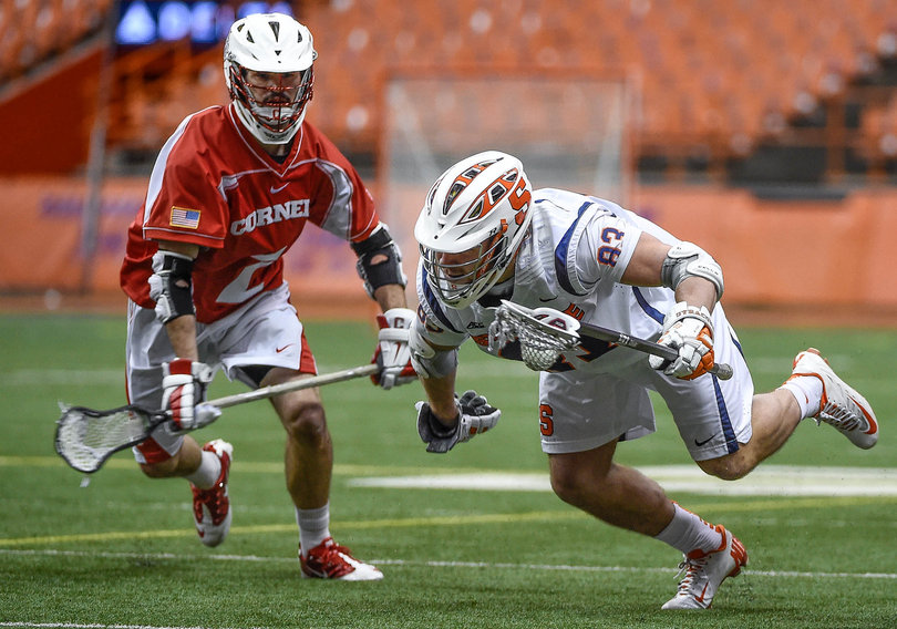 Ralph D'Agostino escapes from a Cornell player while managing to keep the ball in bounds.