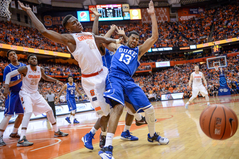 A loose ball gets away from SU forward Tyler Roberson and Duke's Matt Jones. 