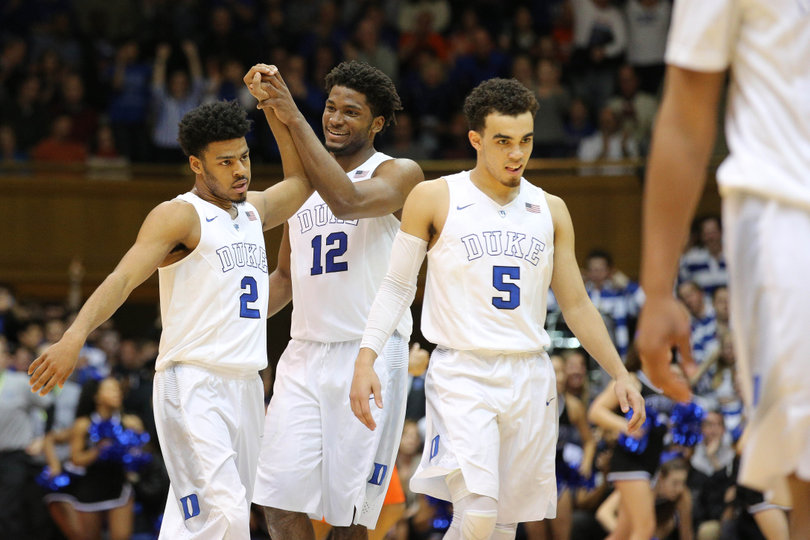 Cook, Justise Winslow (12) and Tyus Jones (5) walk off the court. The three combined for 21 points in the first half.