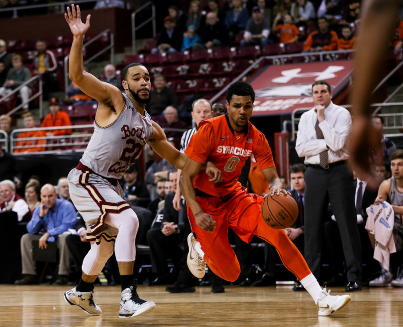 Gbinije tries to turn the corner and get to the basket while BC forward Aaron Brown tries to keep up with him.