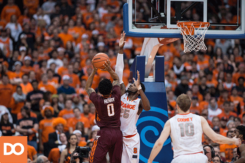 Syracuse senior Rakeem Christmas denies a shot by Virginia Tech forward Shane Henry.