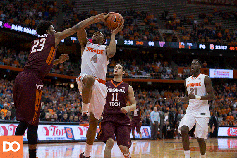 Orange guard Ron Patterson lays in a finger roll for two points over a Virginia Tech defender.