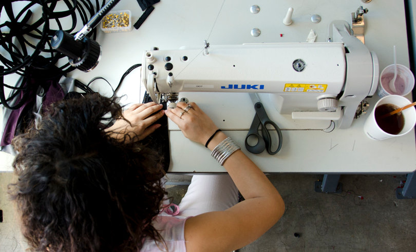 Kiera Henderson spends hours every week working on her first full collection. She’s constantly surrounded by sewing machines on every table. 