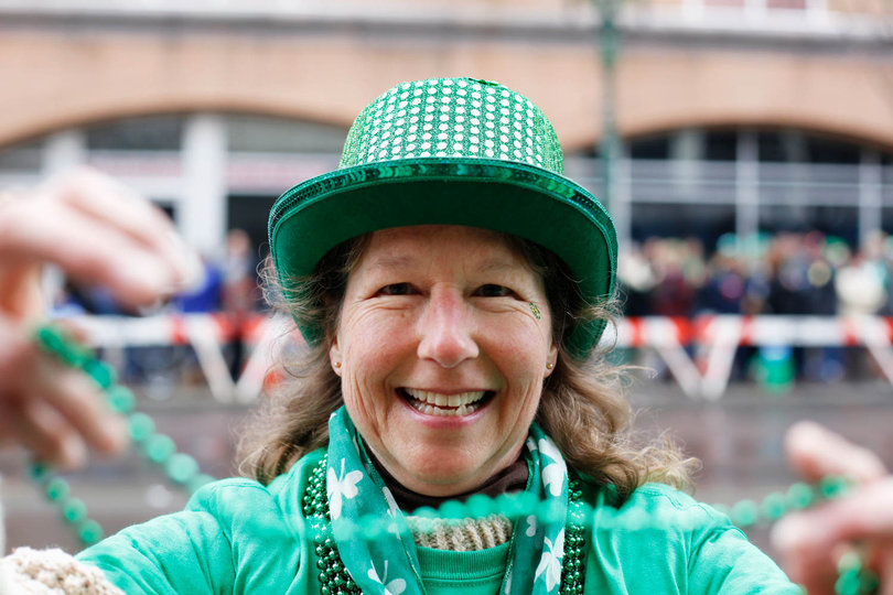 Those participating in the parade distributed beads, candy and accessories to those who came to watch and be a part of the annual Syracuse tradition.