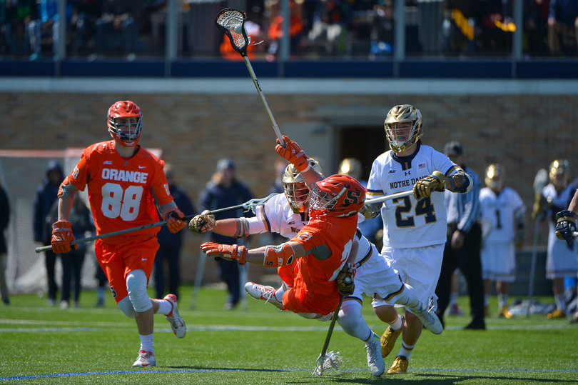 Mike Messina looks to get rid of the ball as the Notre Dame defense comes after him.
